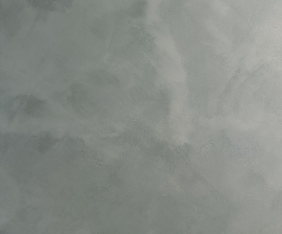 Textured gray background with subtle variations.