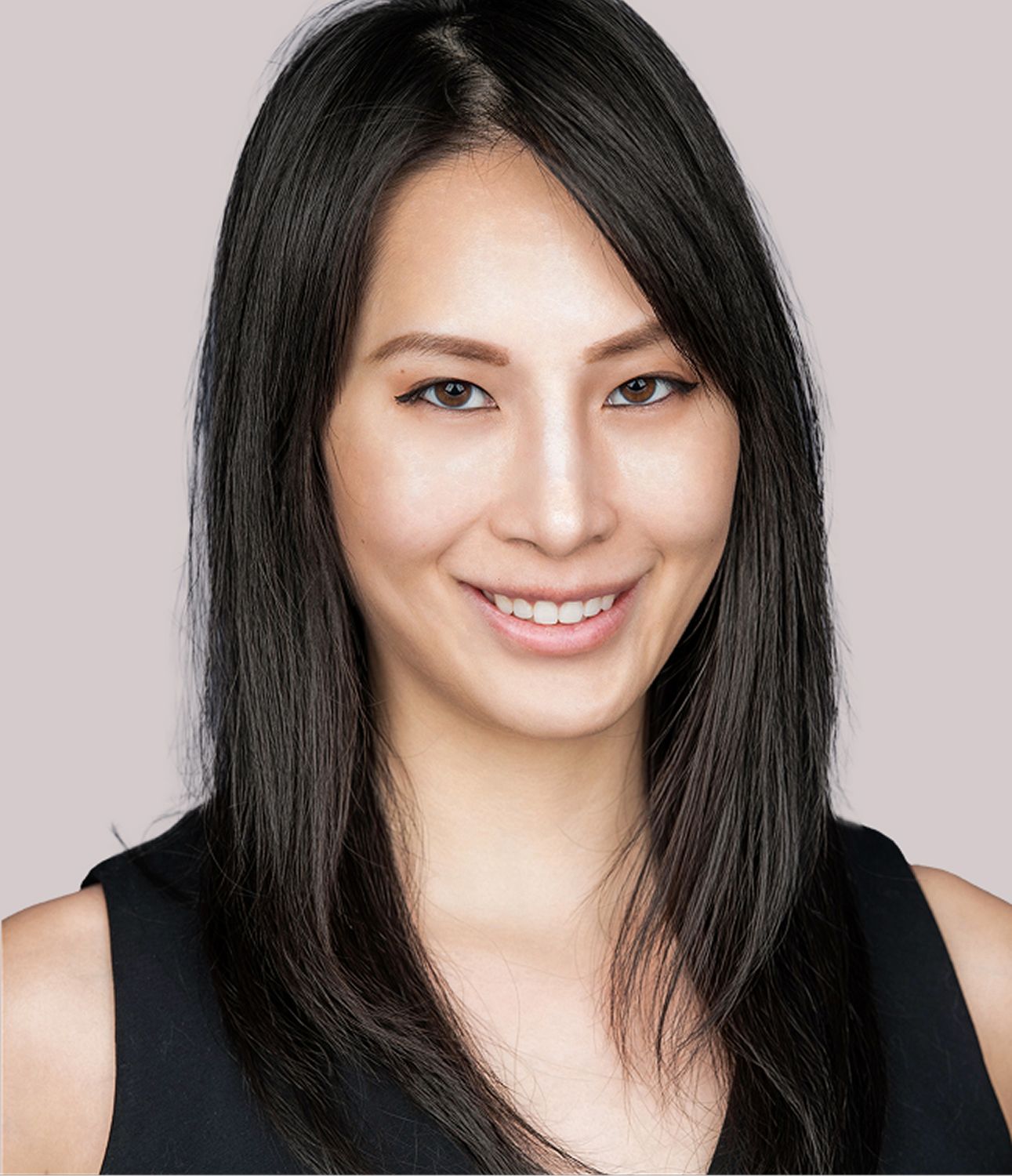 Christine Chen, PA-C, smiling with long dark hair on gray background.