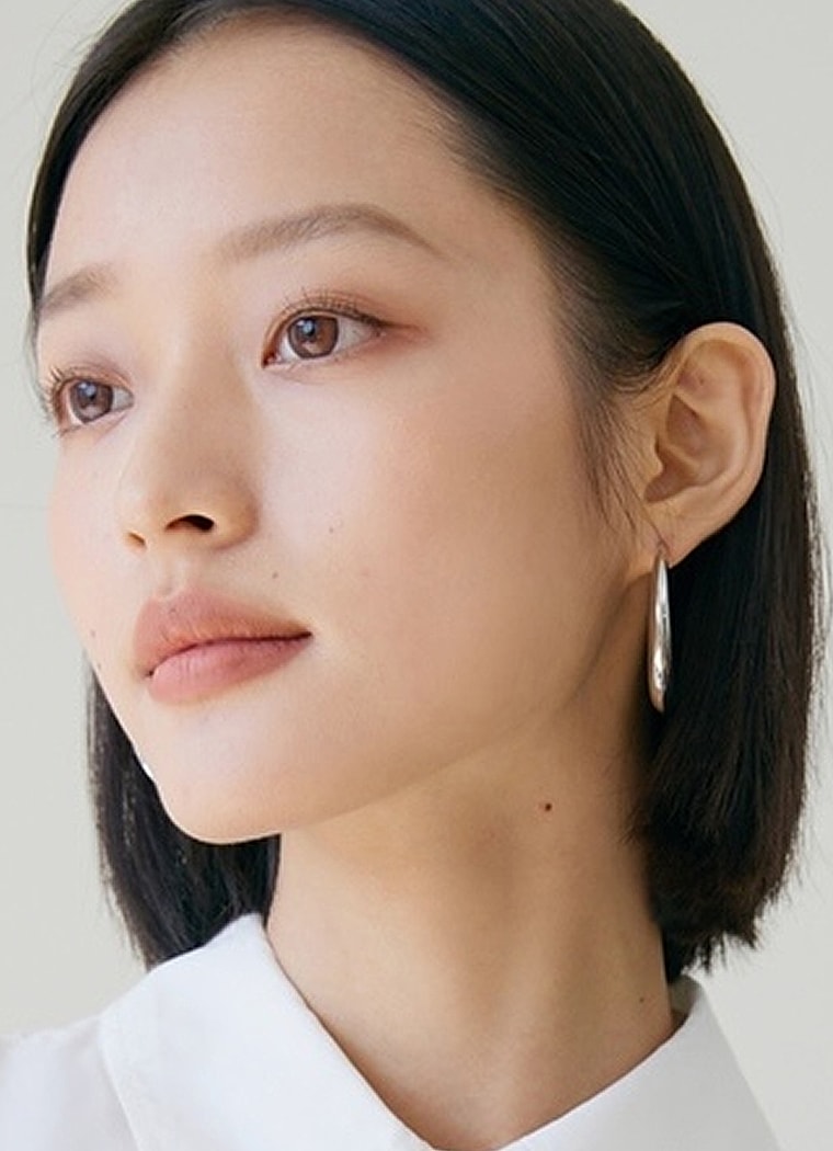 Portrait of a woman with a modern hairstyle.