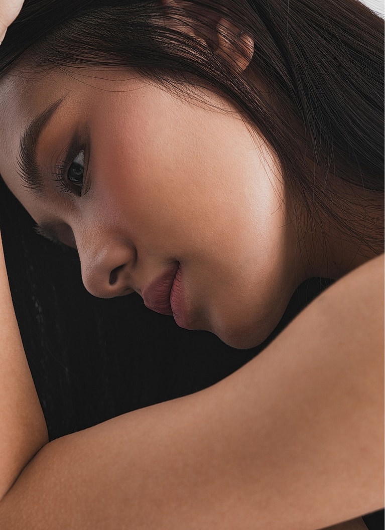 Close-up of a woman's profile and skin.