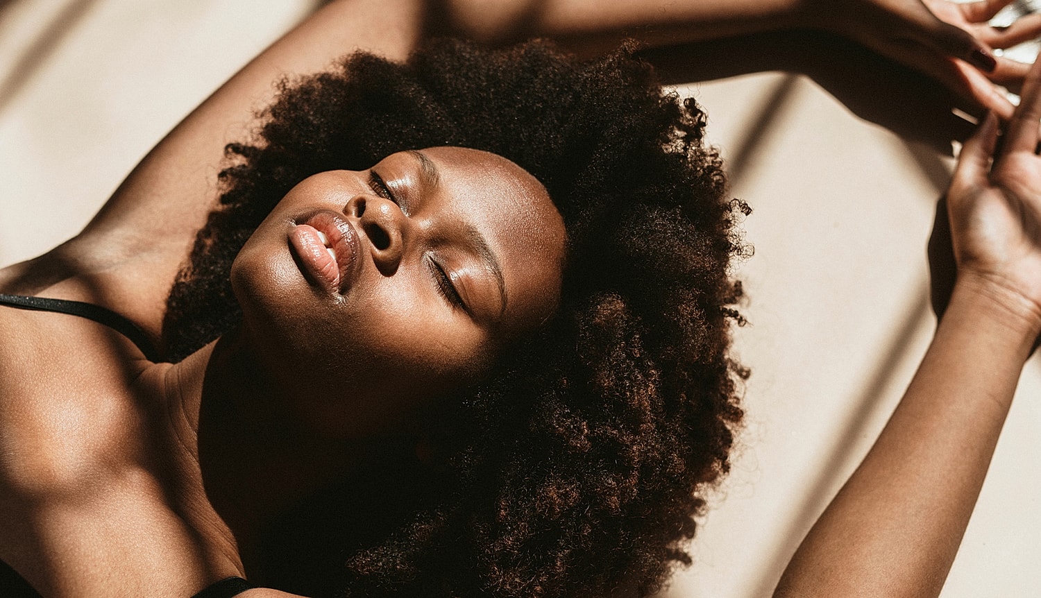 Woman with long hair in a white shirt.