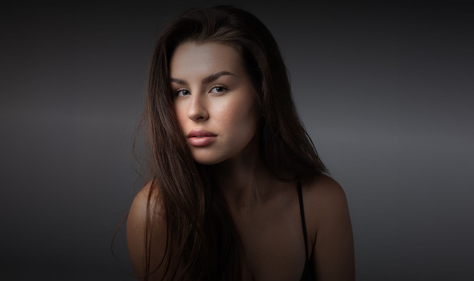 Portrait of a woman with long hair.