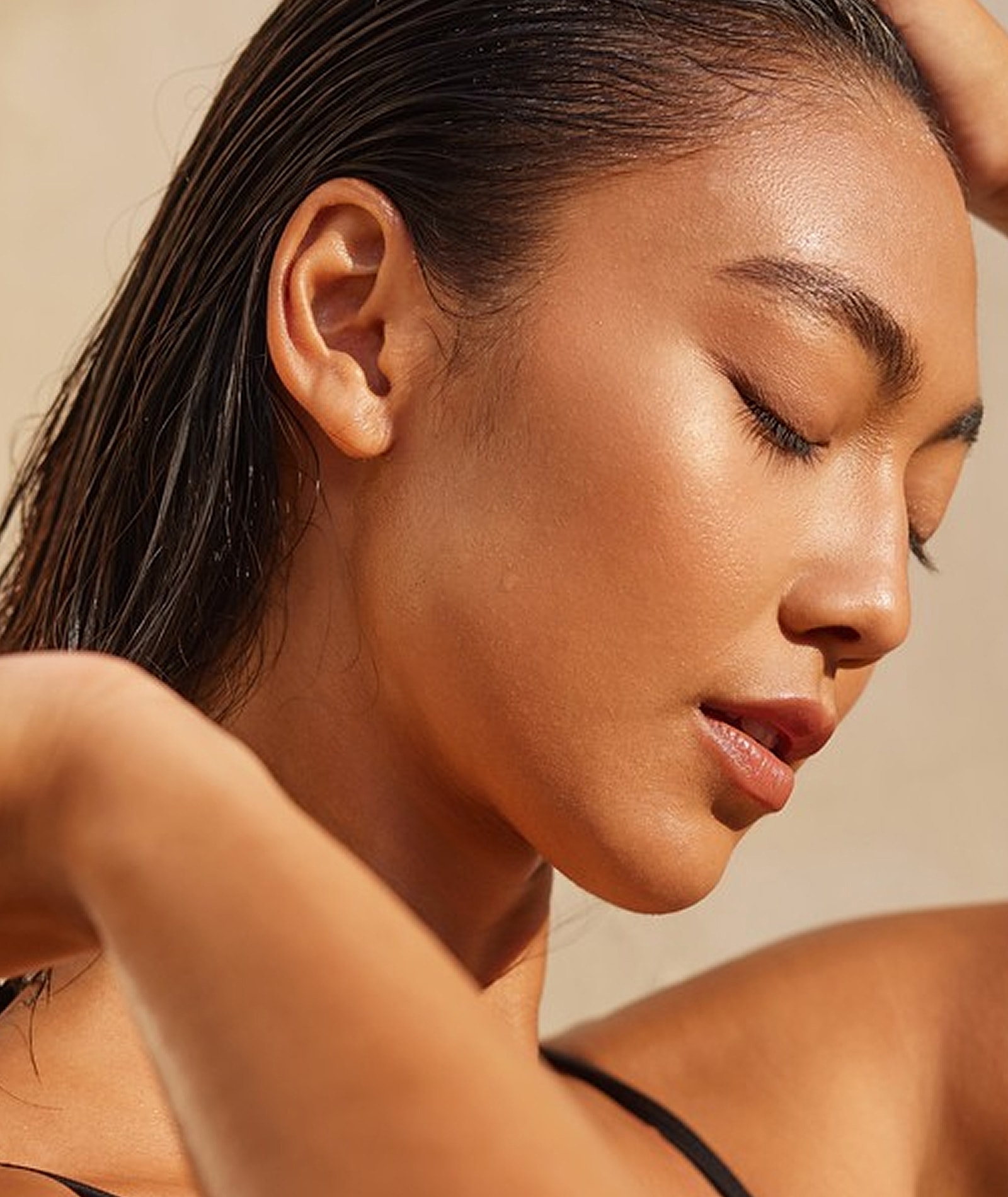 Close-up of a woman with wet hair.