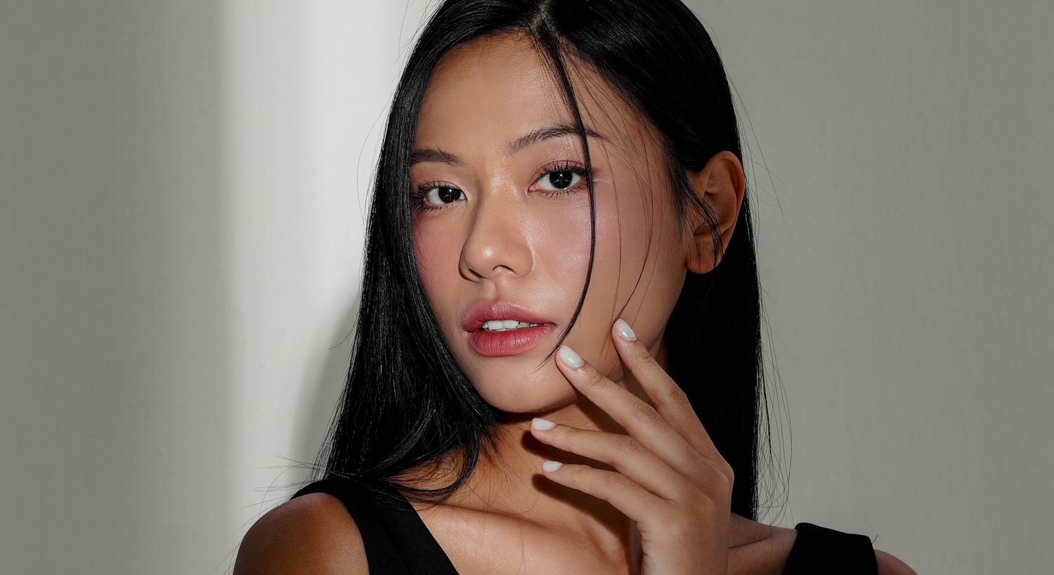 Portrait of woman with long black hair